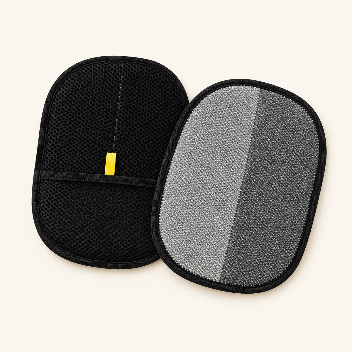 Two pet hair mitts, one showing the black mesh back with the hand pocket and yellow tab, one showing the gray two-way bristle front (2 Mitts pack)